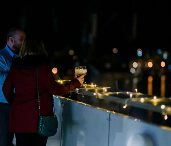m shed people on balcony at night